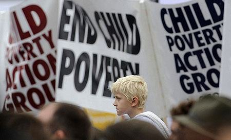 Demonstrators listen to speakers at a rally in Trafalgar Square in central London October 4, 2008. The Campaign to End Child Poverty staged a march through London claiming the 2009 Budget is the last real chance the British government has to meet its 2010 target to halve child poverty